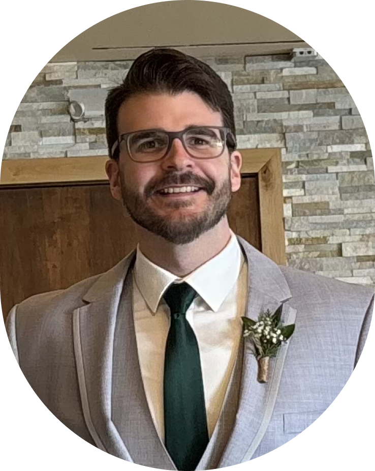 a headshot picture of a person in a suit and tie.